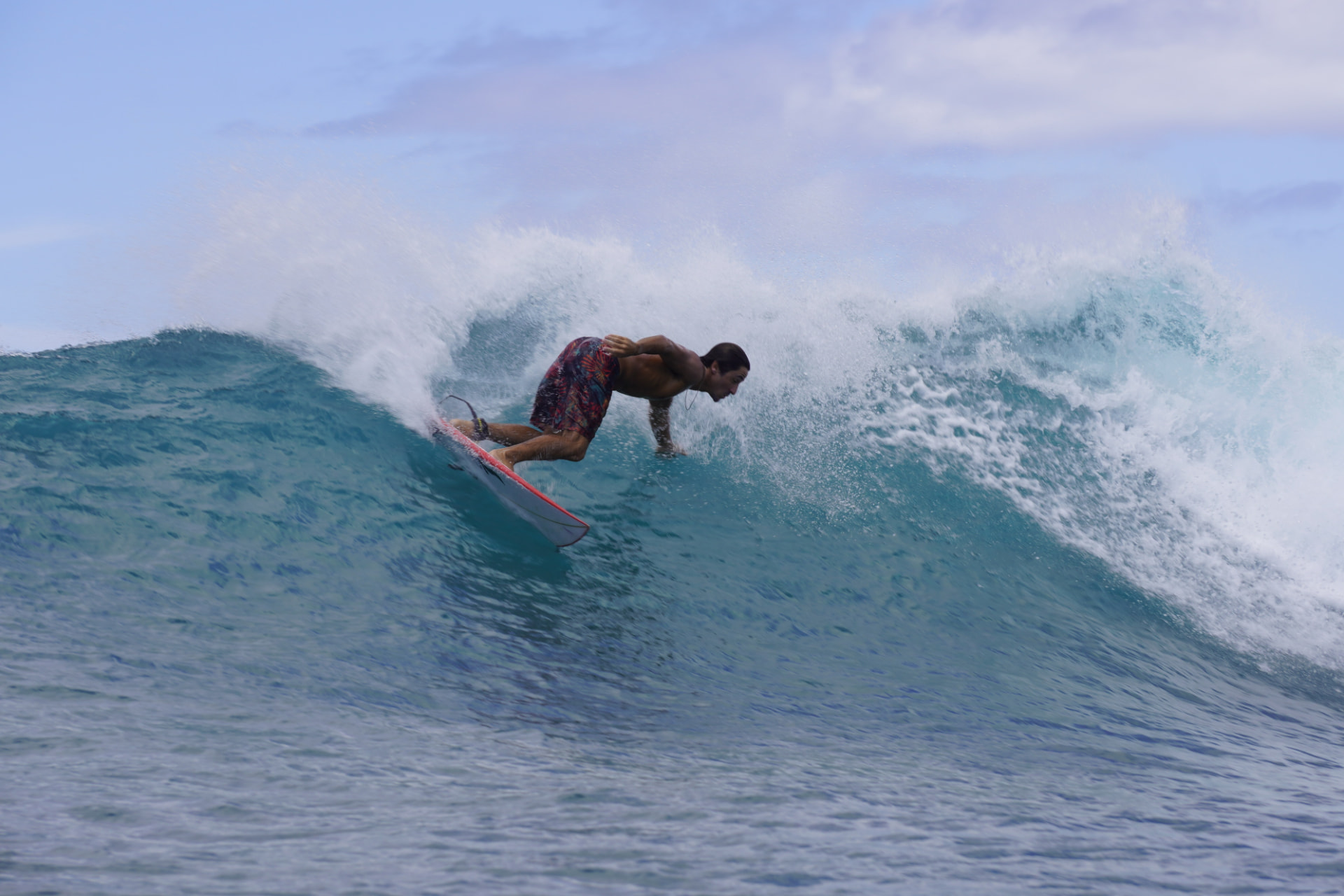 Adam surfing a wave